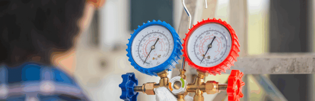 A person monitoring gauges for their geothermal energy system
