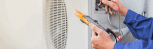 A technician performing maintenance or repairs on a geothermal system