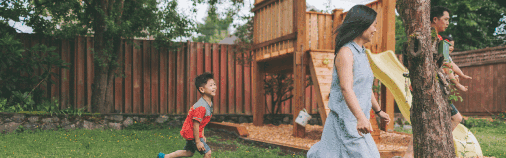 Parents having fun with their children in the backyard