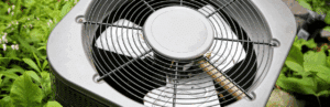 the top of a condenser fan outdoor unit for an air conditioning system