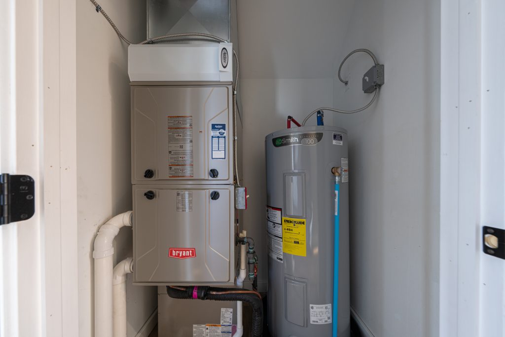 home has been updated with a new residential furnace and hot water tank installed in the basement