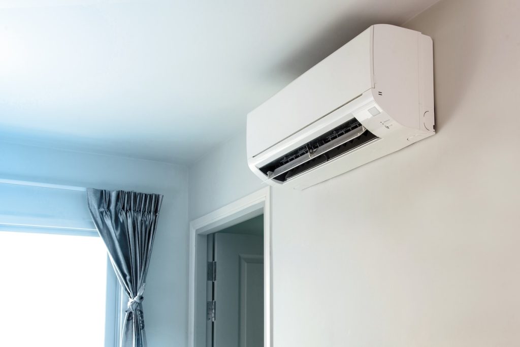 Air conditioner on wall background
