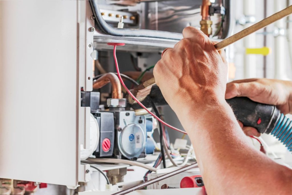 person setting up a boiler